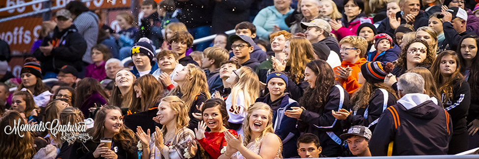 Students Cheering at Football Game